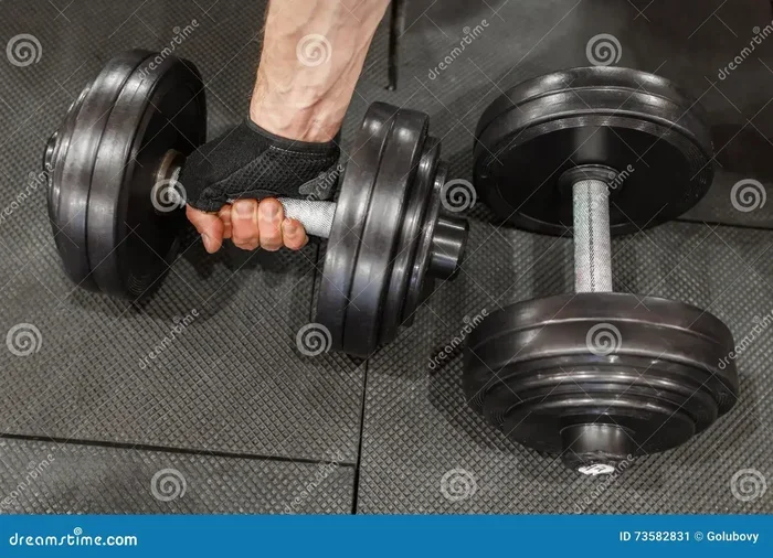 How to Hold Two Dumbbells in One Hand